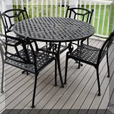 L04. Iron patio table and 4 chairs. 